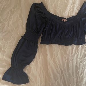 Navy blue silk cropped blouse. Smocking on flared sleeves. Silk